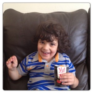 Little Man Enjoying Yu! Snacks