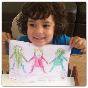 Little Man Proud of his Paper Dolls