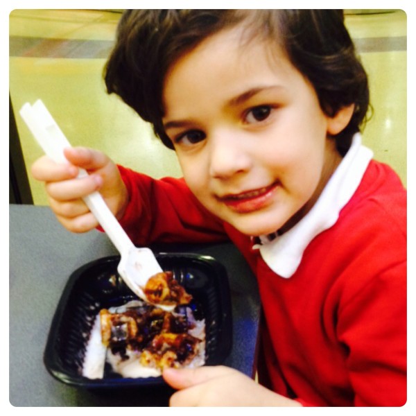 Little Man Enjoying Belgium Waffle and Ice Cream