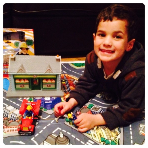 Little Man Playing with Fireman Sam Toys