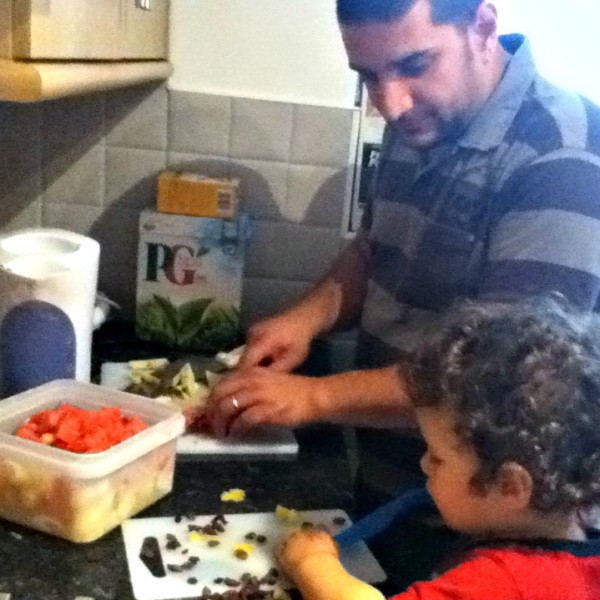 Little Man and Hubby Making Fruit Salad