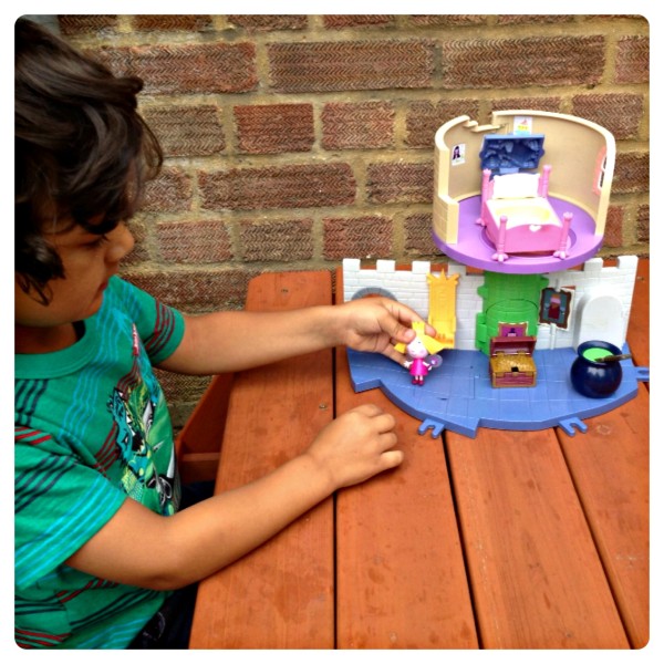 Little man playing with Ben and Holly’s Little Kingdom Thistle Castle Playset